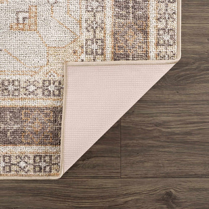 Albas Washable Area Rug by Boutique Rugs, beige taupe tufted rug with folded edge on wood floor on Tampa Home & Garden Store