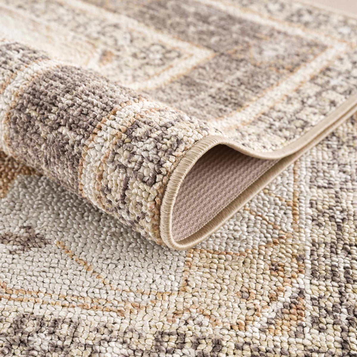 Albas washable area rug by Boutique Rugs, beige taupe loop-pile with cream border on Tampa Home & Garden Store
