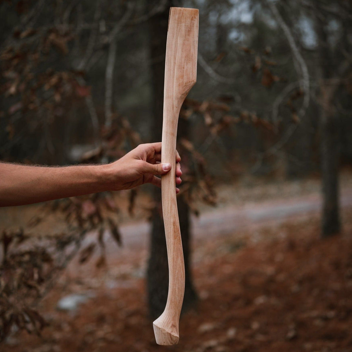 Whiskey River Premium Heritage 28C 28in axe handle in natural wood, held by hand on Tampa Home & Garden Store