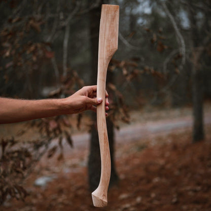 Whiskey River Premium Heritage 28C 28in axe handle in natural wood, held by hand on Tampa Home & Garden Store