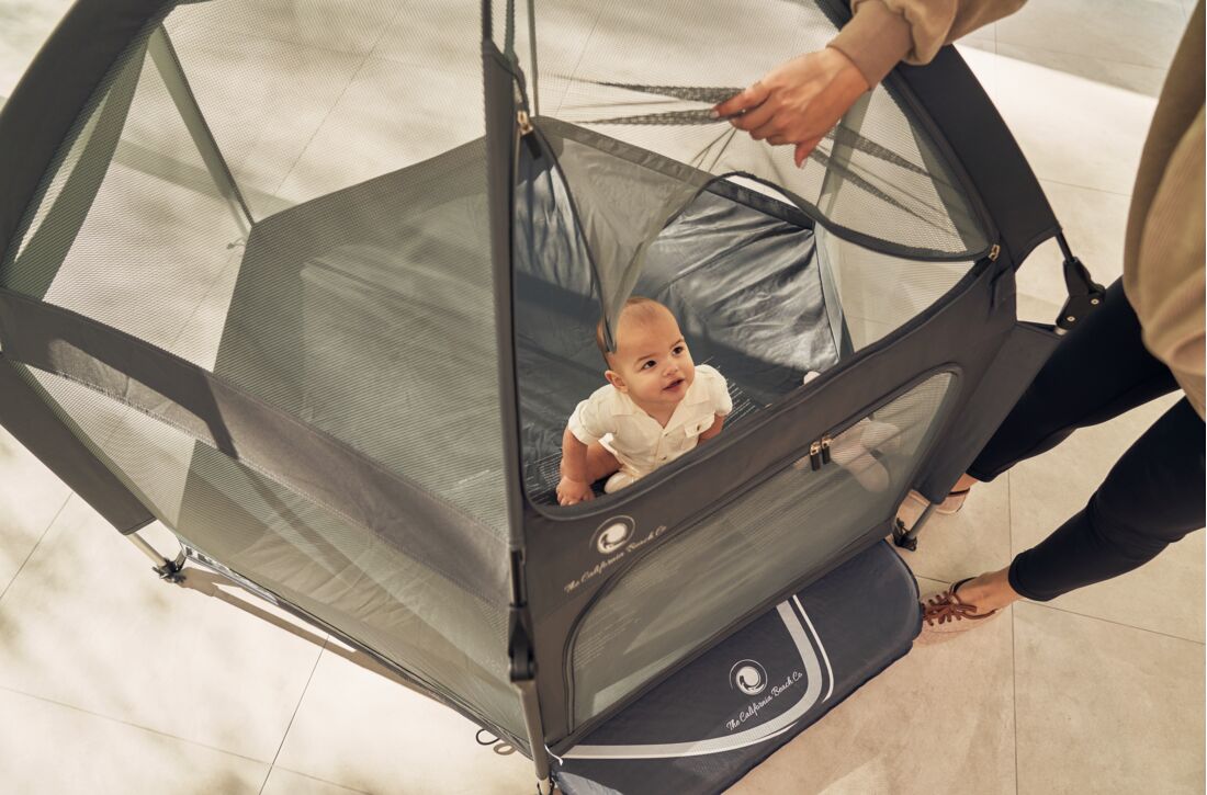 Pop 'N Go Playpen gray mesh play yard with baby inside, The California Beach Company LLC on Tampa Home & Garden Store