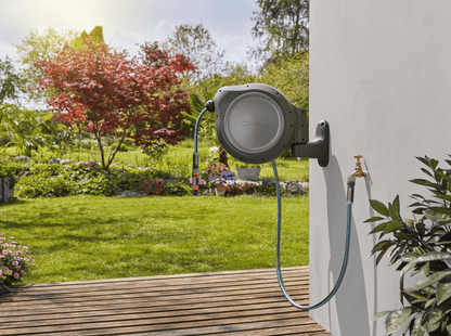 Retractable Hose Reel RollUp 50 ft by Gardena, wall-mounted grey housing with blue hose on Tampa Home & Garden Store