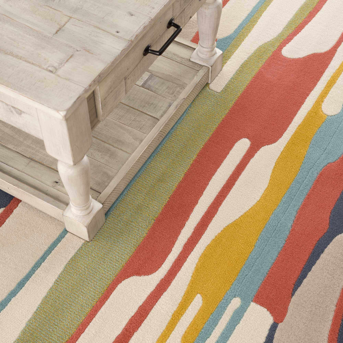 Southfields colorful modern area rug with bold stripes on light wood floor on Tampa Home & Garden Store