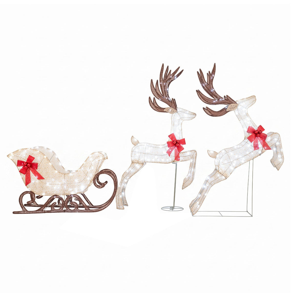 Lighted outdoor reindeer and sleigh set with white bodies and red bows on Tampa Home & Garden Store