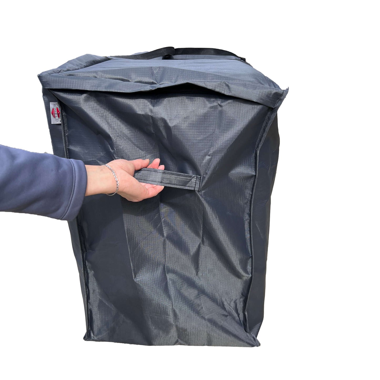 Sofa cushion bag Mercury, dark gray cushion storage bag with Shield Outdoor Covers label and strap on Tampa Home & Garden Store