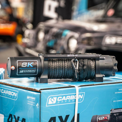 Carbon Offroad 6K winch with long drum and braided rope on a workbench on Tampa Home & Garden Store