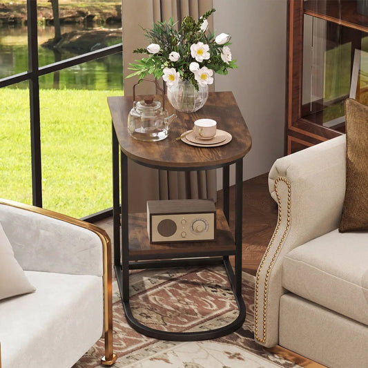 C-shaped side table with faux marble top, dark metal curved base; teapot and floral vase on Tampa Home & Garden Store