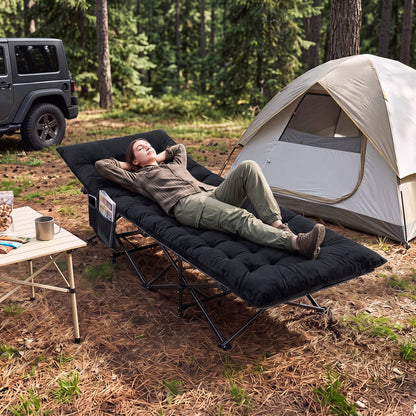 Camping cot for adults with padded mat in black, set up beside tent and camping table on Tampa Home & Garden Store