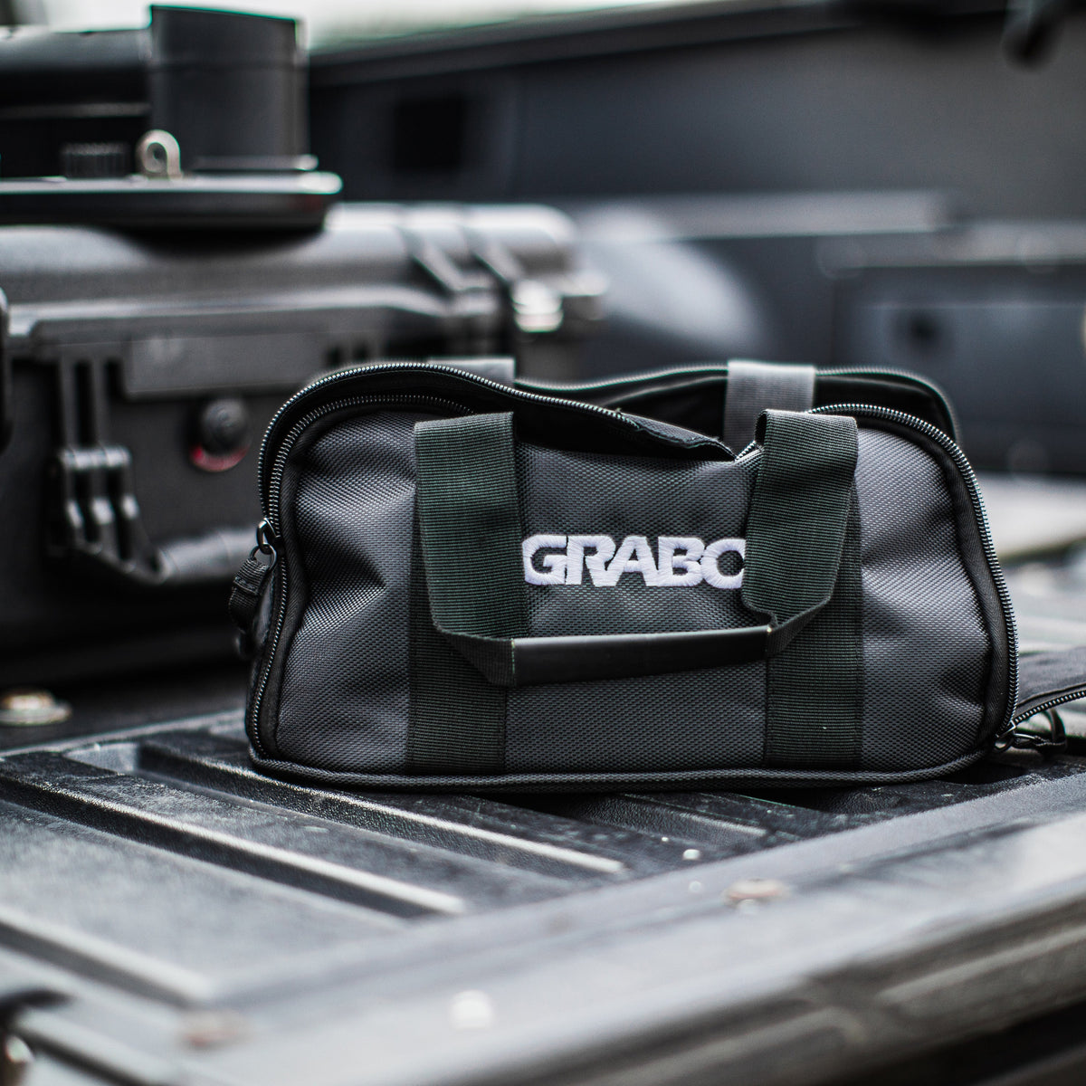 GRABO Canvas Carry Bag gray canvas tool bag with green straps and GRABO logo on front on Tampa Home & Garden Store