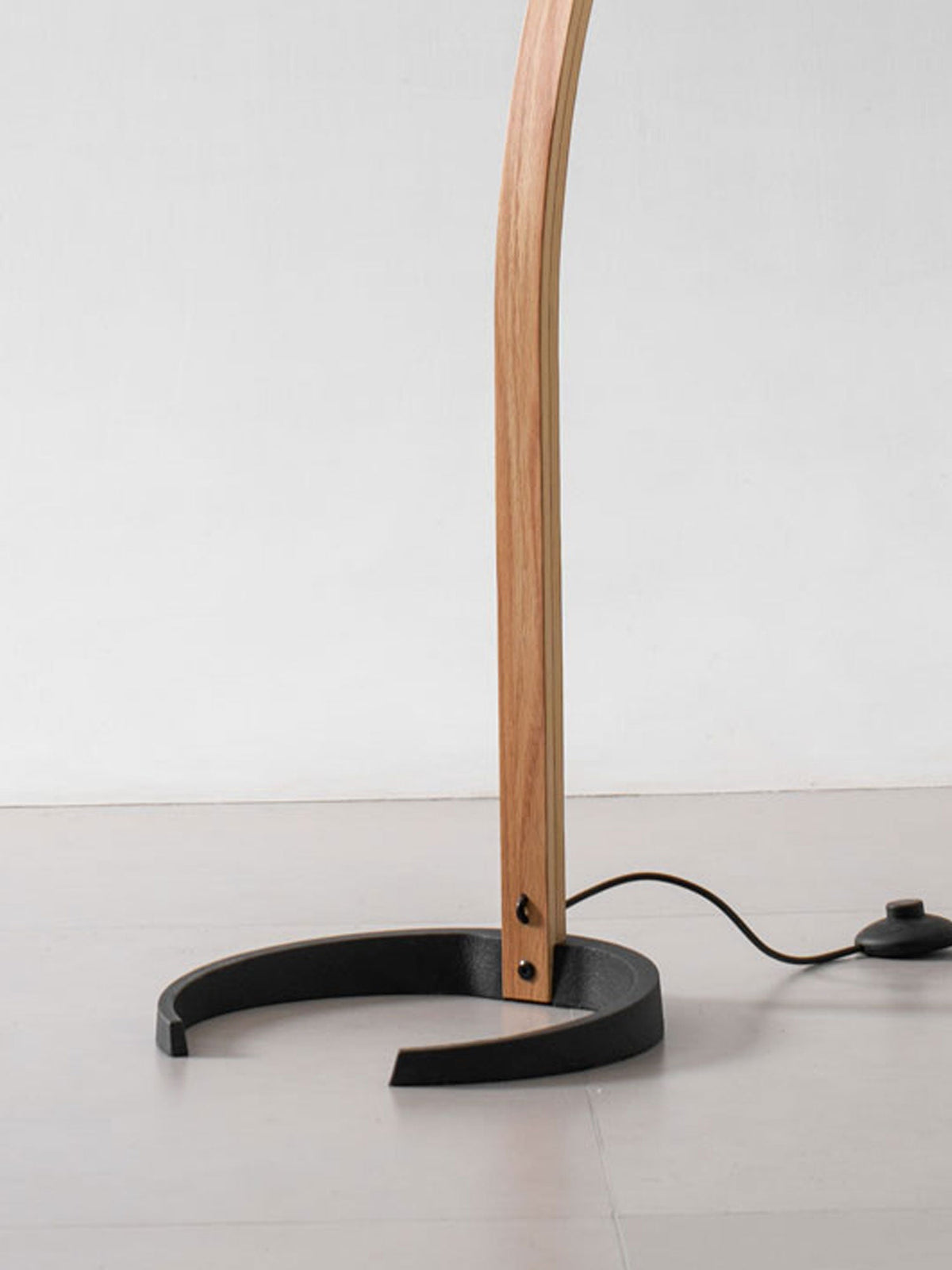 Arbora Arc floor lamp with beech wood stem and black curved base plug-in living room lamp on Tampa Home & Garden Store