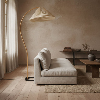 Arbora Arc floor lamp in beech wood with pleated shade beside beige sofa in living room on Tampa Home & Garden Store