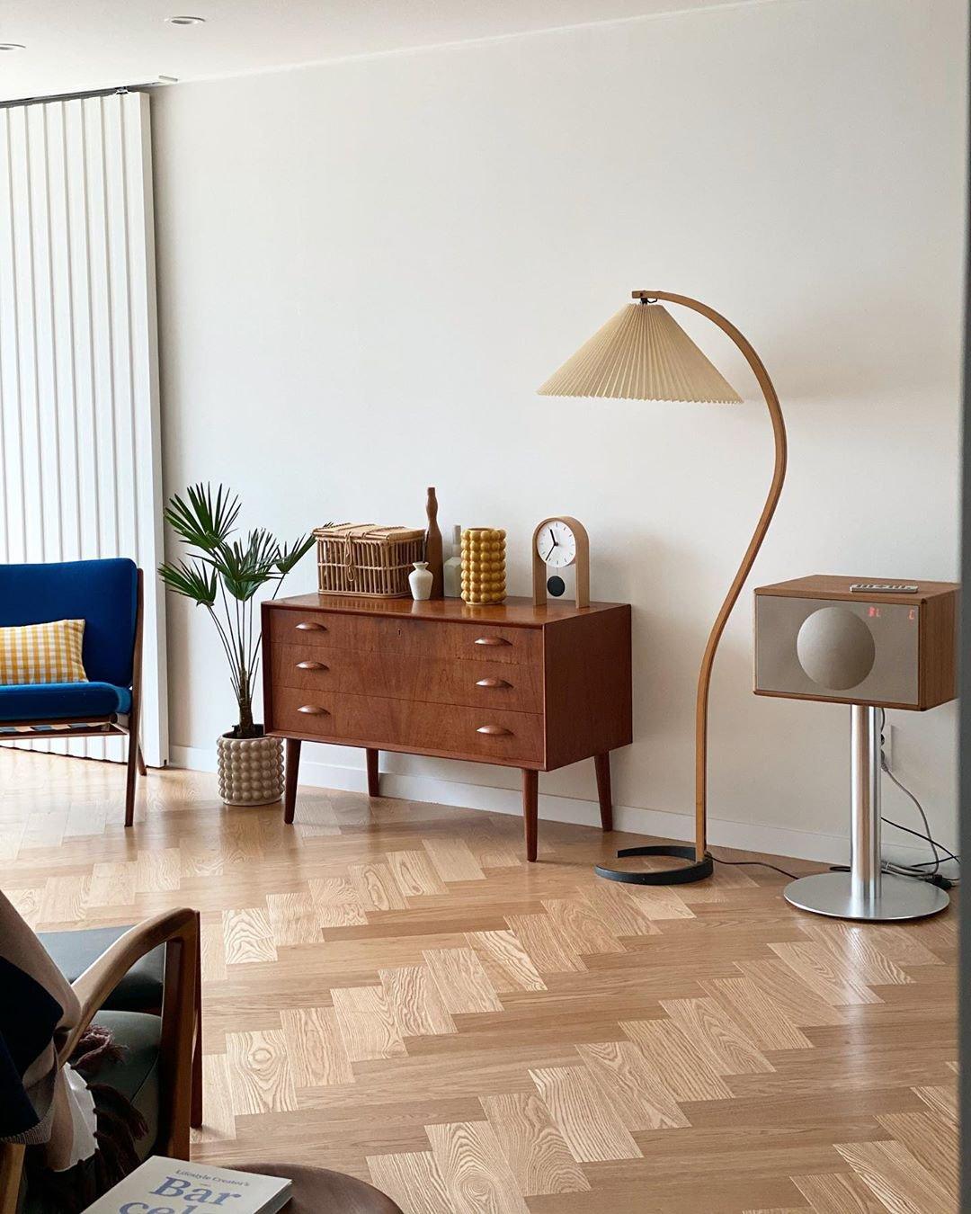 Arbora Arc floor lamp by Moktan Sabai with beech wood arc and pleated beige shade on Tampa Home & Garden Store