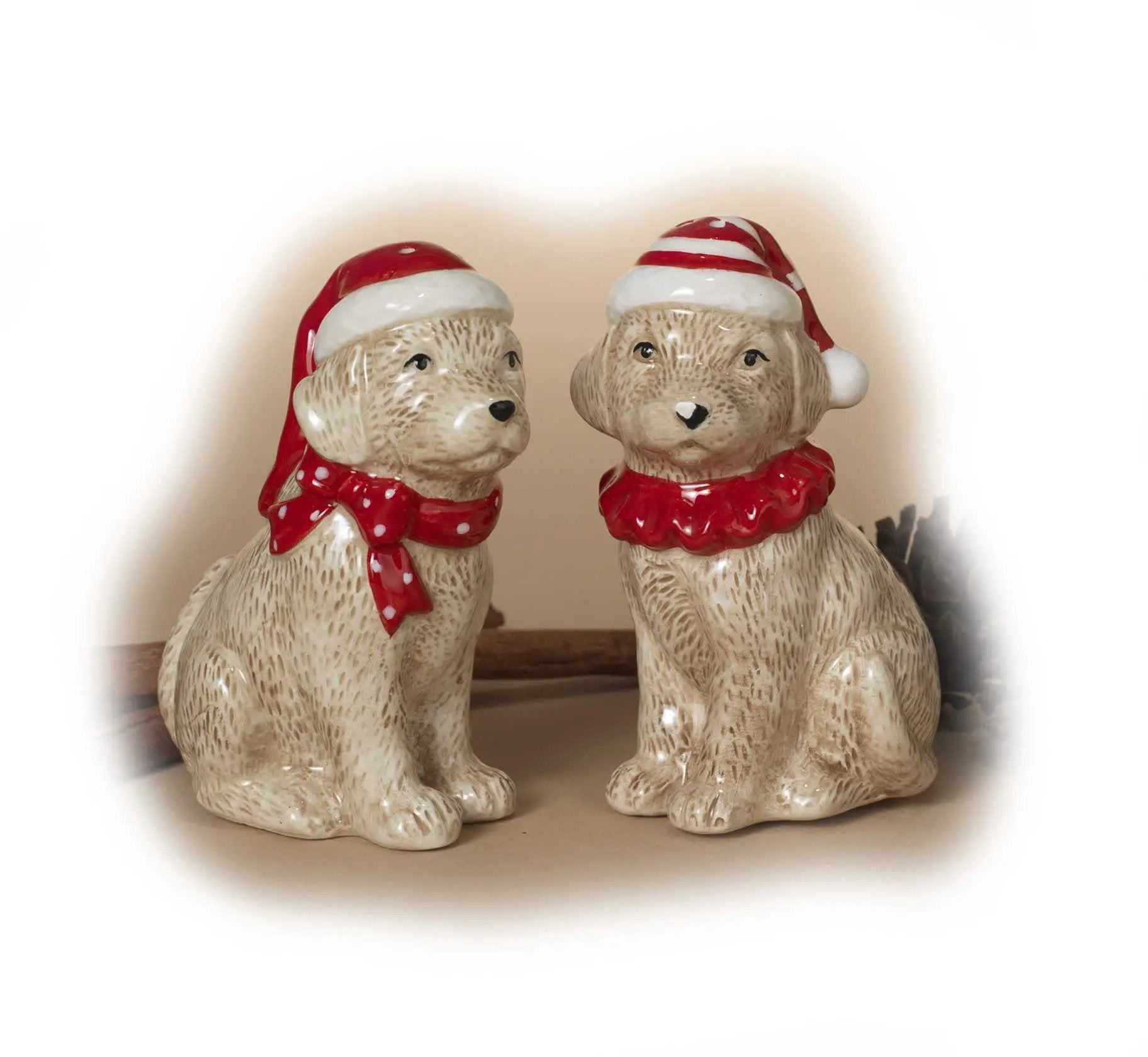 Ceramic holiday dog salt and pepper set featuring two dogs in red Santa hats and scarves on Tampa Home & Garden Store