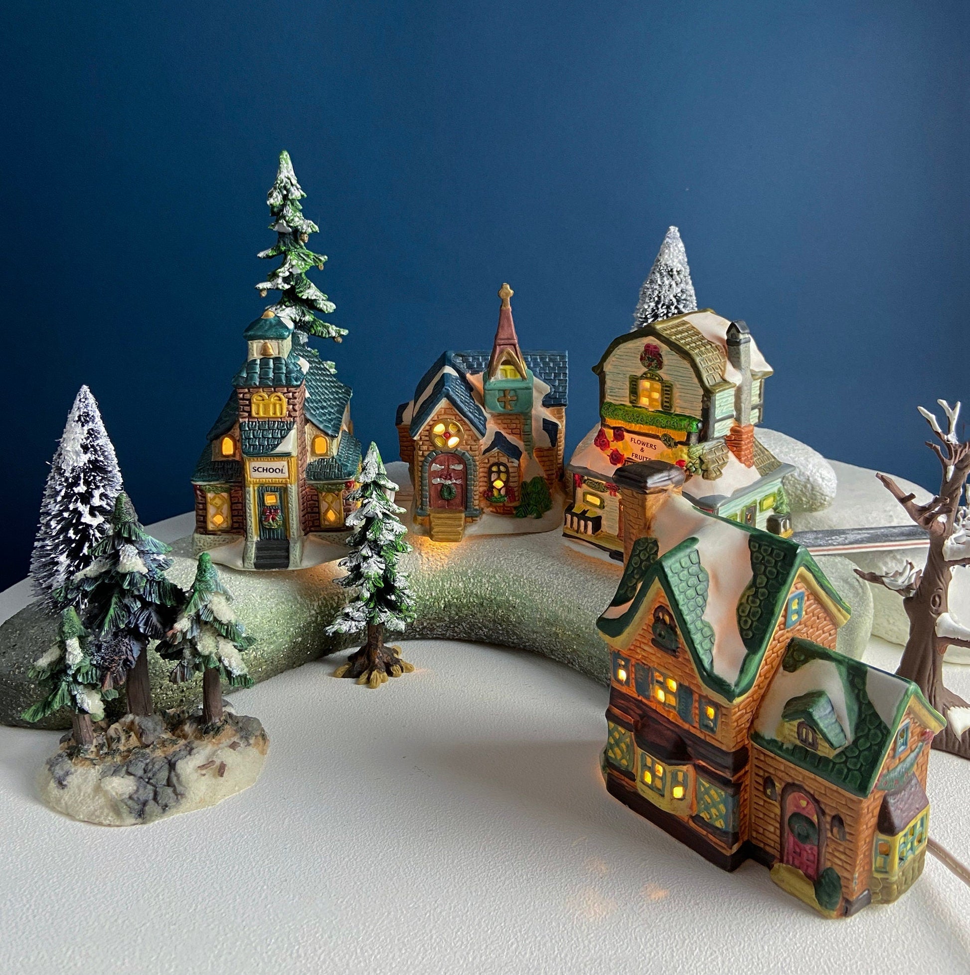 Christmas Village Collection of Small Illuminated Houses. Set of 4 Bldgs: Mill, 2 Churches, Train St., Council Offices, 2 Sheep and 3 Pines. - Tampa Home & Garden Store
