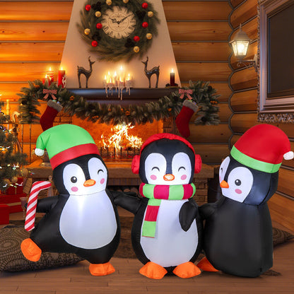 Christmas inflatable penguin family with built-in LED lights; three penguins in hats on Tampa Home & Garden Store