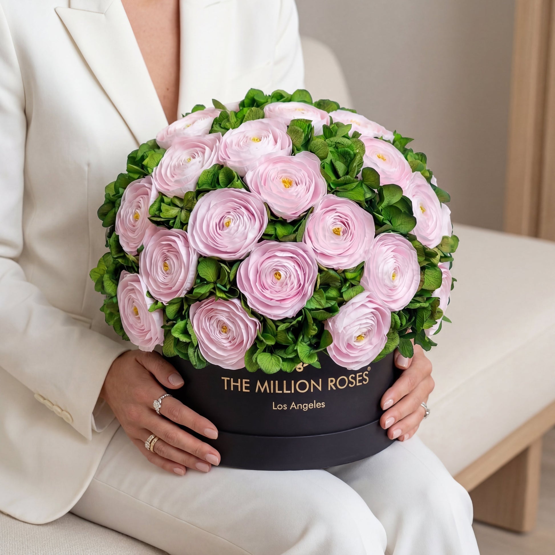Classic Black Box bouquet with light pink Persian buttercups and green hydrangeas on Tampa Home & Garden Store