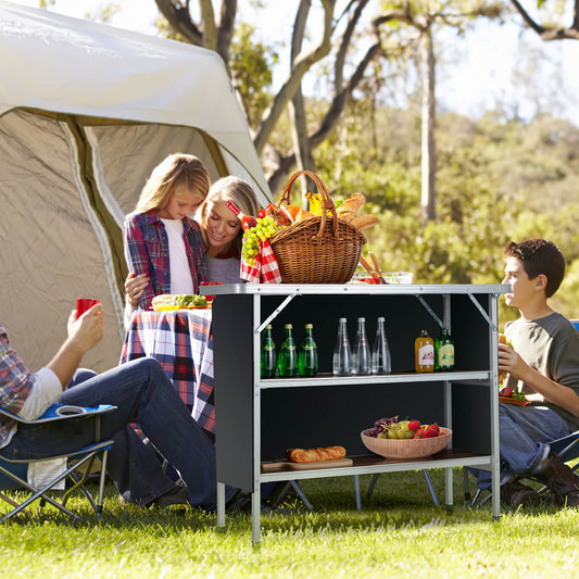 GemGear folding camping table with 2-tier open shelves for outdoor BBQ, black metal frame on Tampa Home & Garden Store