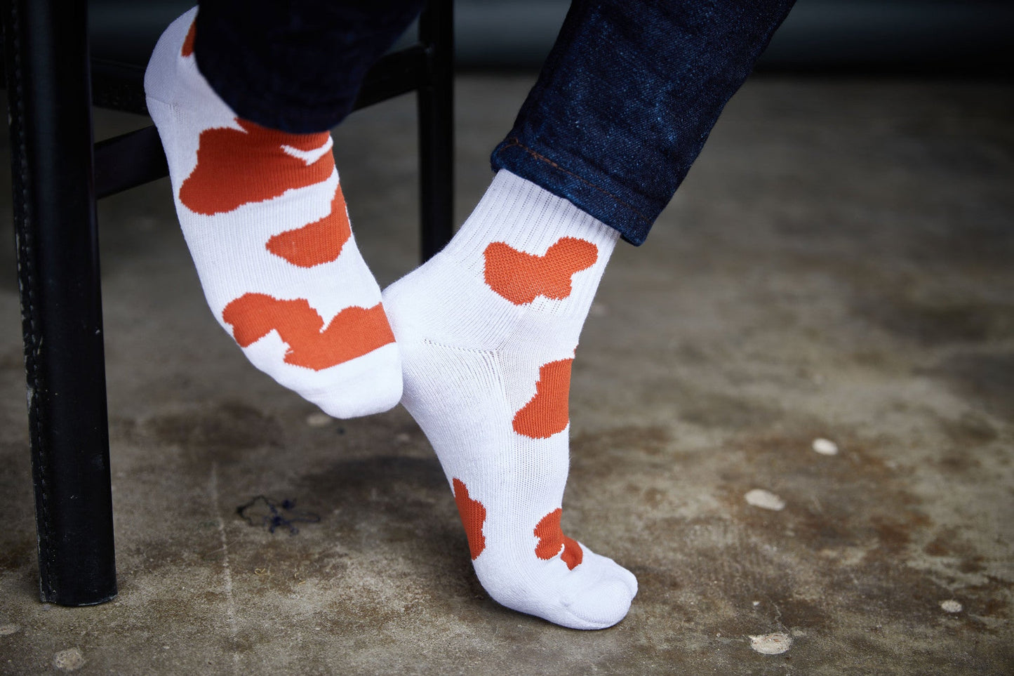 DeadSoxy CiderOrange mixed 4-pack cow-print socks, white base with orange spots on Tampa Home & Garden Store