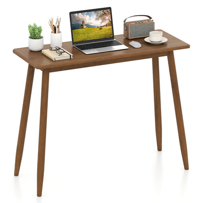 Writing desk with rubber wood legs and spacious tabletop, laptop and plant on Tampa Home & Garden Store