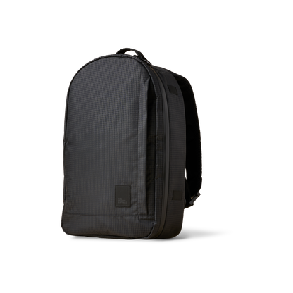 Conceal Pack 21L backpack in dark gray grid fabric with The Brown Buffalo badge on Tampa Home & Garden Store