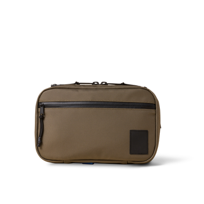 Concealsling crossbody bag by The Brown Buffalo in brown canvas with front zip pocket on Tampa Home & Garden Store