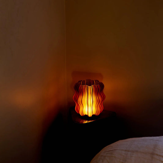 Mini Wavy Lamp table lamp with amber ribbed wavy shade, warm ambient glow on Tampa Home & Garden Store