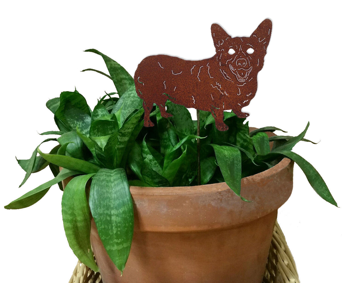 Corgi plant stake in rust metal finish atop a terracotta pot with green foliage on Tampa Home & Garden Store