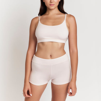 Net Positive organic cotton boyshorts in soft pink on model on Tampa Home & Garden Store