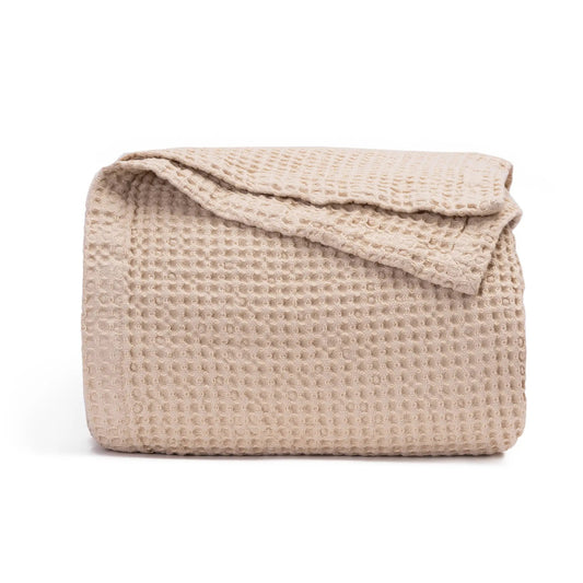 Waffle weave cotton blanket in beige, folded, all-season by Organic Cotton Mart on Tampa Home & Garden Store