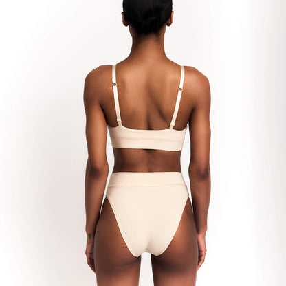 Cheeky Tanga briefs in nude organic cotton with thin adjustable straps Net Positive on Tampa Home & Garden Store