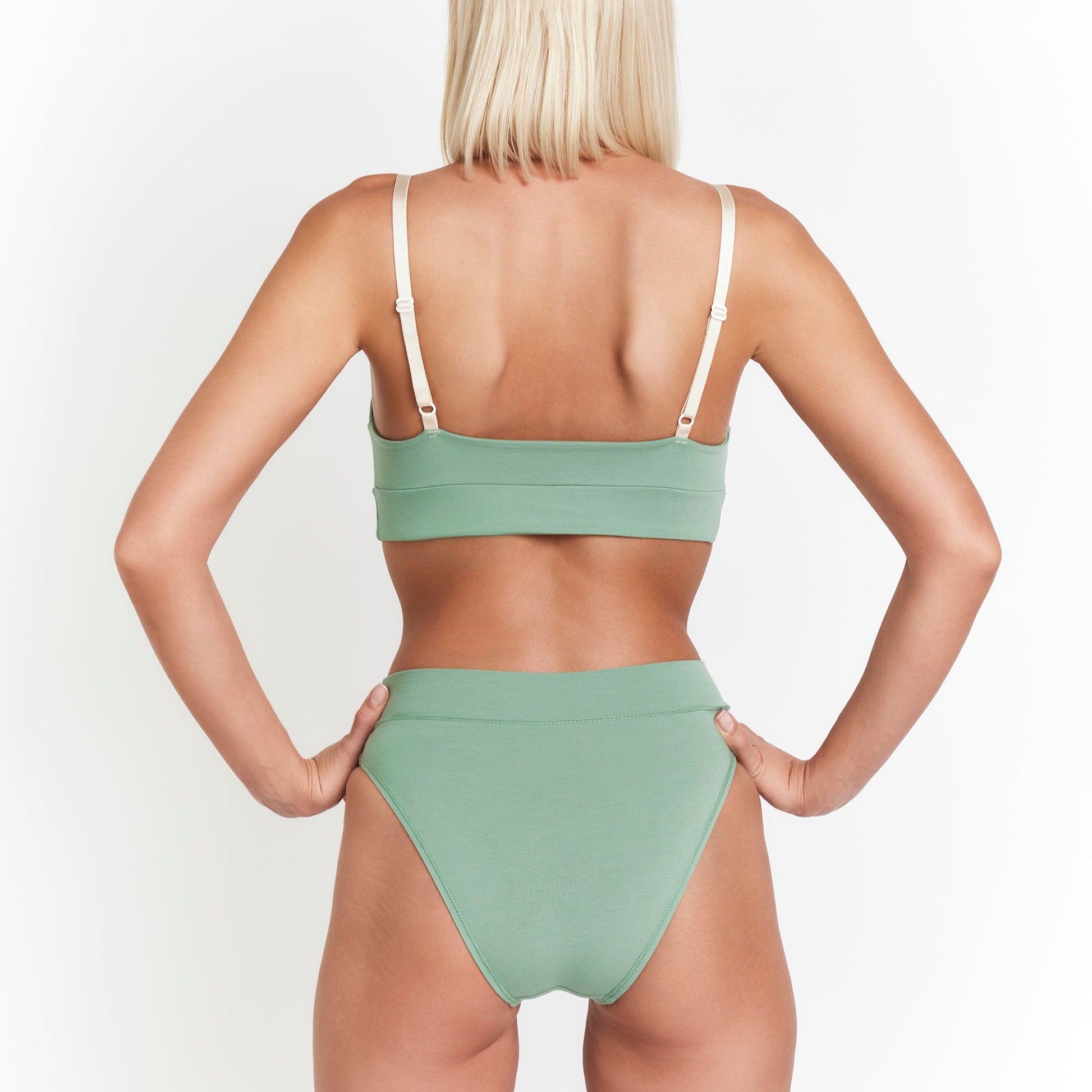 Net Positive Cheeky Tanga in organic cotton, sage green briefs with cream straps, back view on Tampa Home & Garden Store