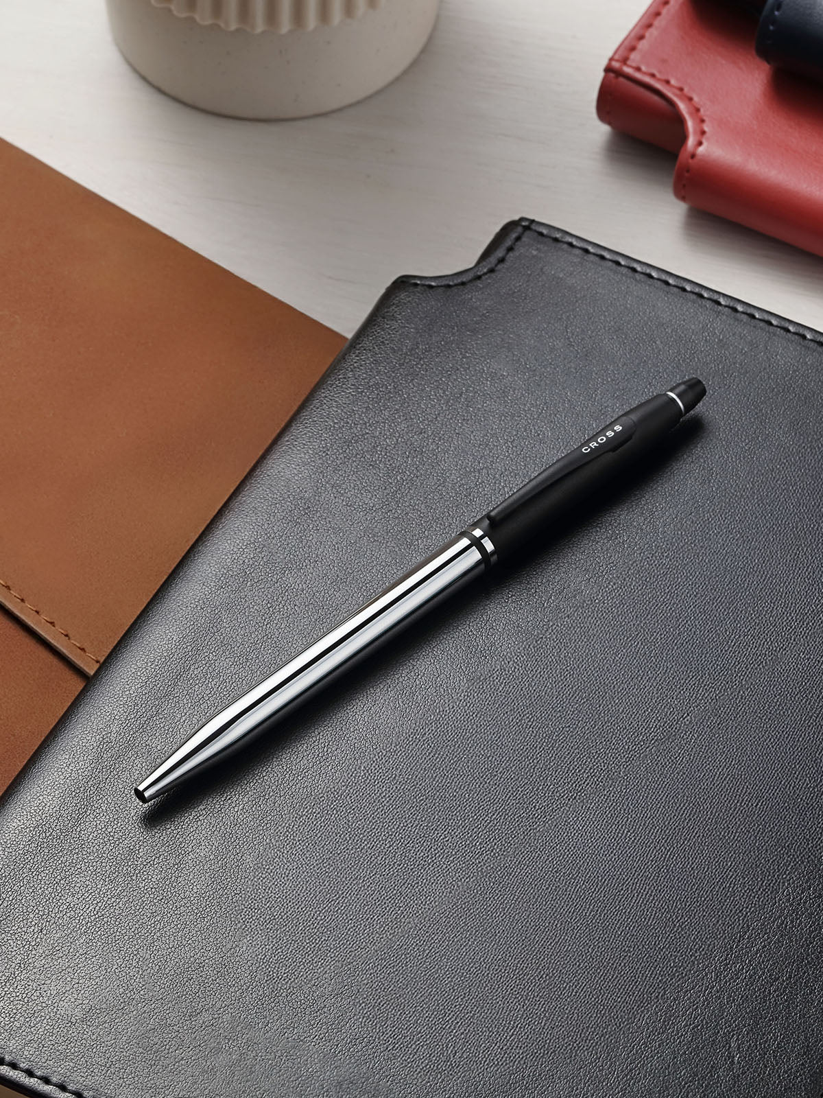 Click Tuxedo Chrome ballpoint pen by A.T. Cross on black notebook on Tampa Home & Garden Store