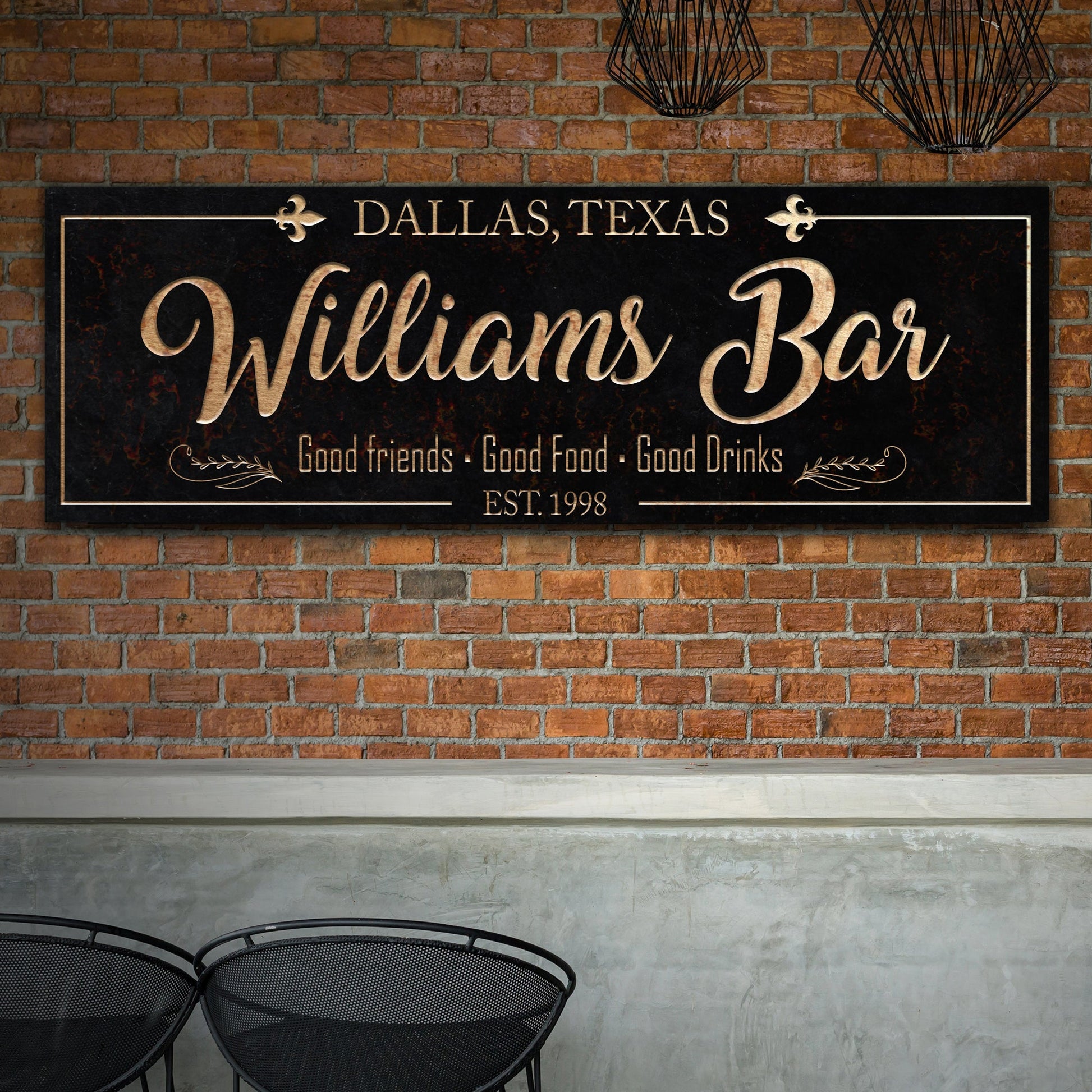 Custom Bar Sign Canvas, black with gold Williams Bar script on a brick wall, two black chairs on Tampa Home & Garden Store