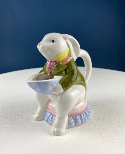 Ceramic bunny creamer dispenser in pastel clothing holding a blue bowl on Tampa Home & Garden Store