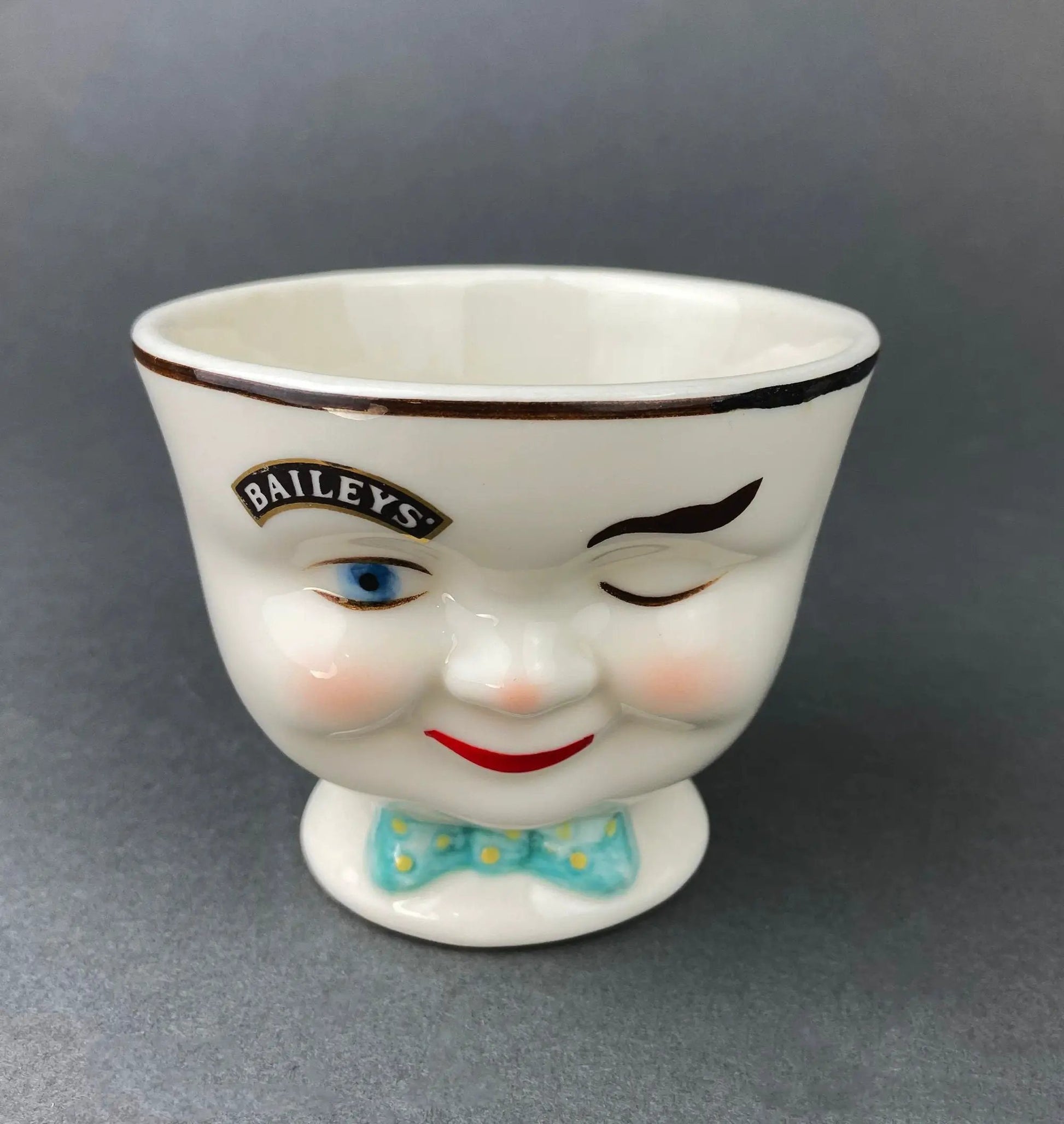 Cute bunny armchair sugar creamer, porcelain with teal bow, Bailey's label visible on Tampa Home & Garden Store