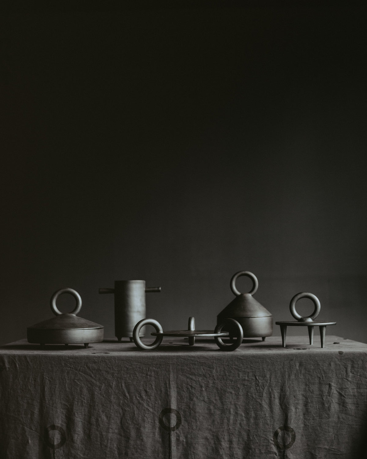 Shallow Serving Bowl with Lid Guculia in dark metal with ring-handled lid among decor vessels on Tampa Home & Garden Store