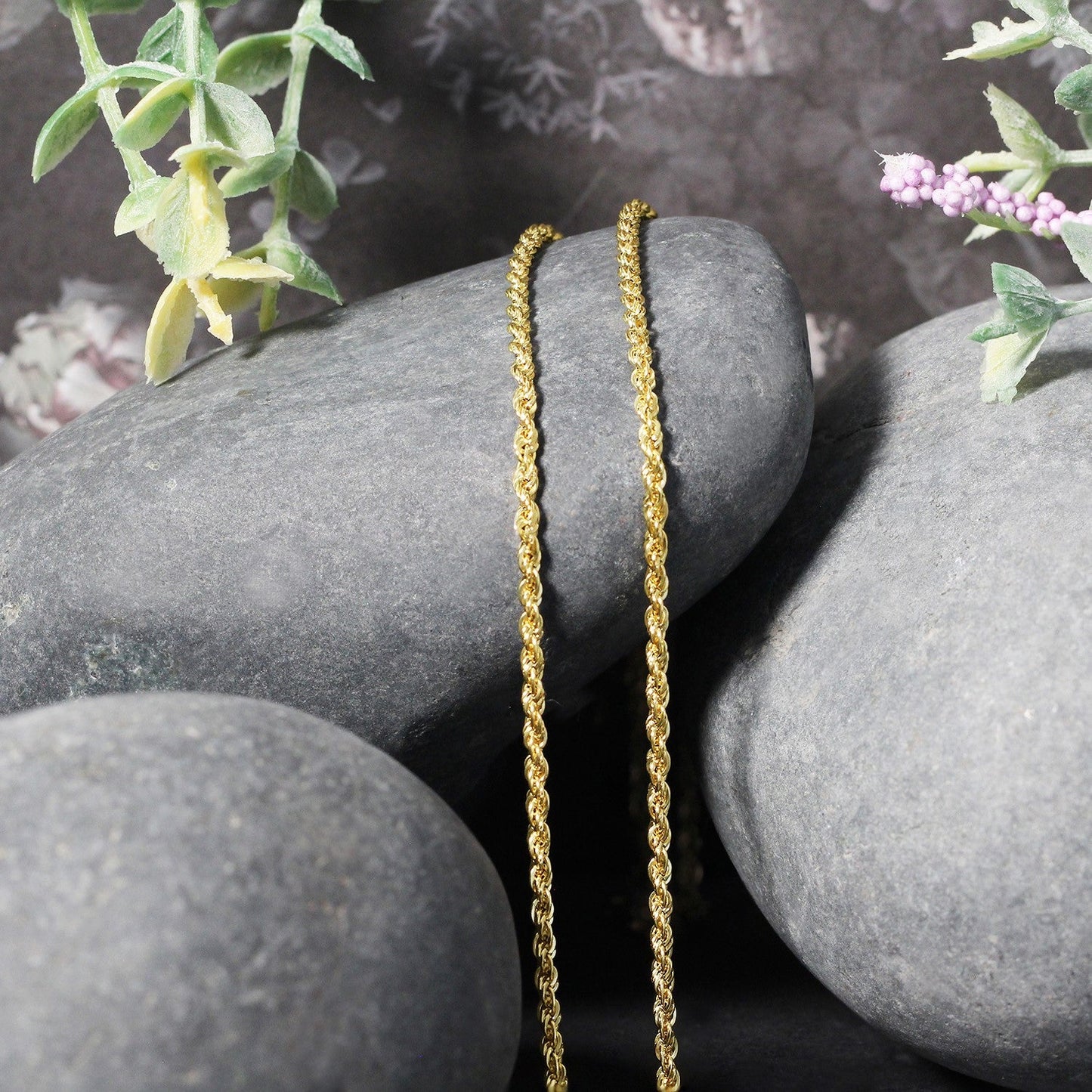 2.0mm 14k yellow gold light rope chain necklace, two chains drape over smooth stones on Tampa Home & Garden Store