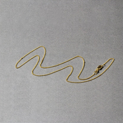 14k yellow gold diamond-cut rolo chain necklace, 1.1mm, on gray background on Tampa Home & Garden Store