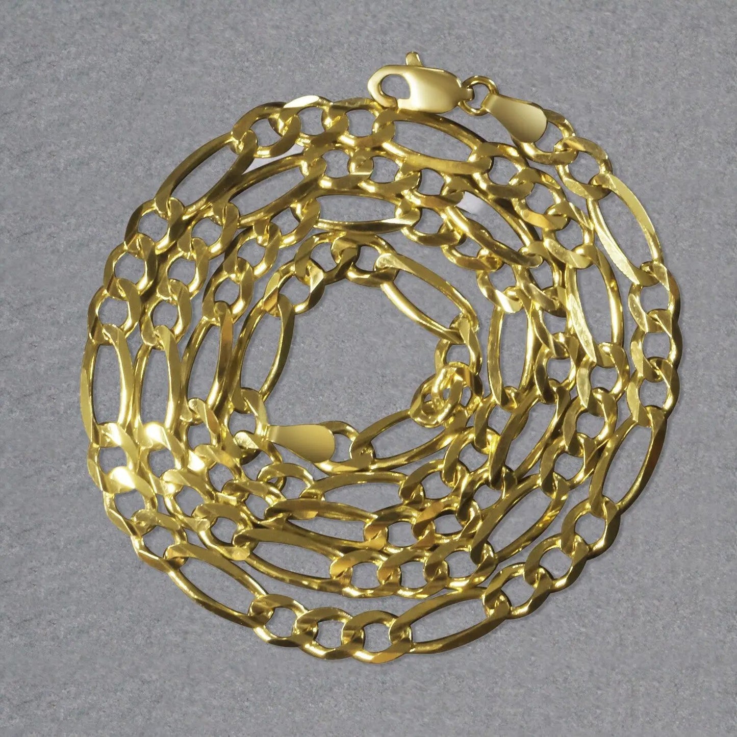 10K yellow gold solid Figaro chain necklace 4.5mm by Bids.com coiled on Tampa Home & Garden Store