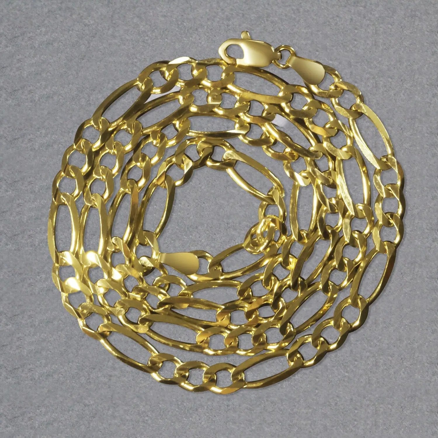 10K yellow gold solid Figaro chain necklace 4.5mm by Bids.com coiled on Tampa Home & Garden Store
