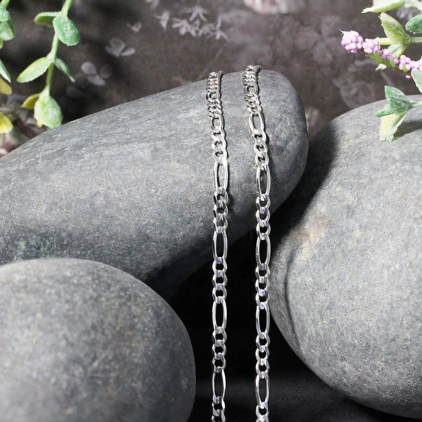 3.0mm 14k white gold solid Figaro chain necklace with twin links draped on smooth rocks on Tampa Home & Garden Store