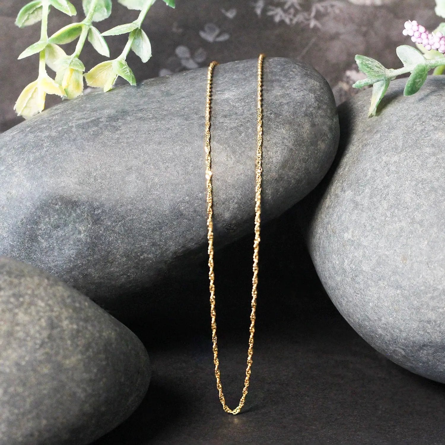 14k yellow gold Singapore chain necklace 1.0mm with delicate textured links on rocks on Tampa Home & Garden Store