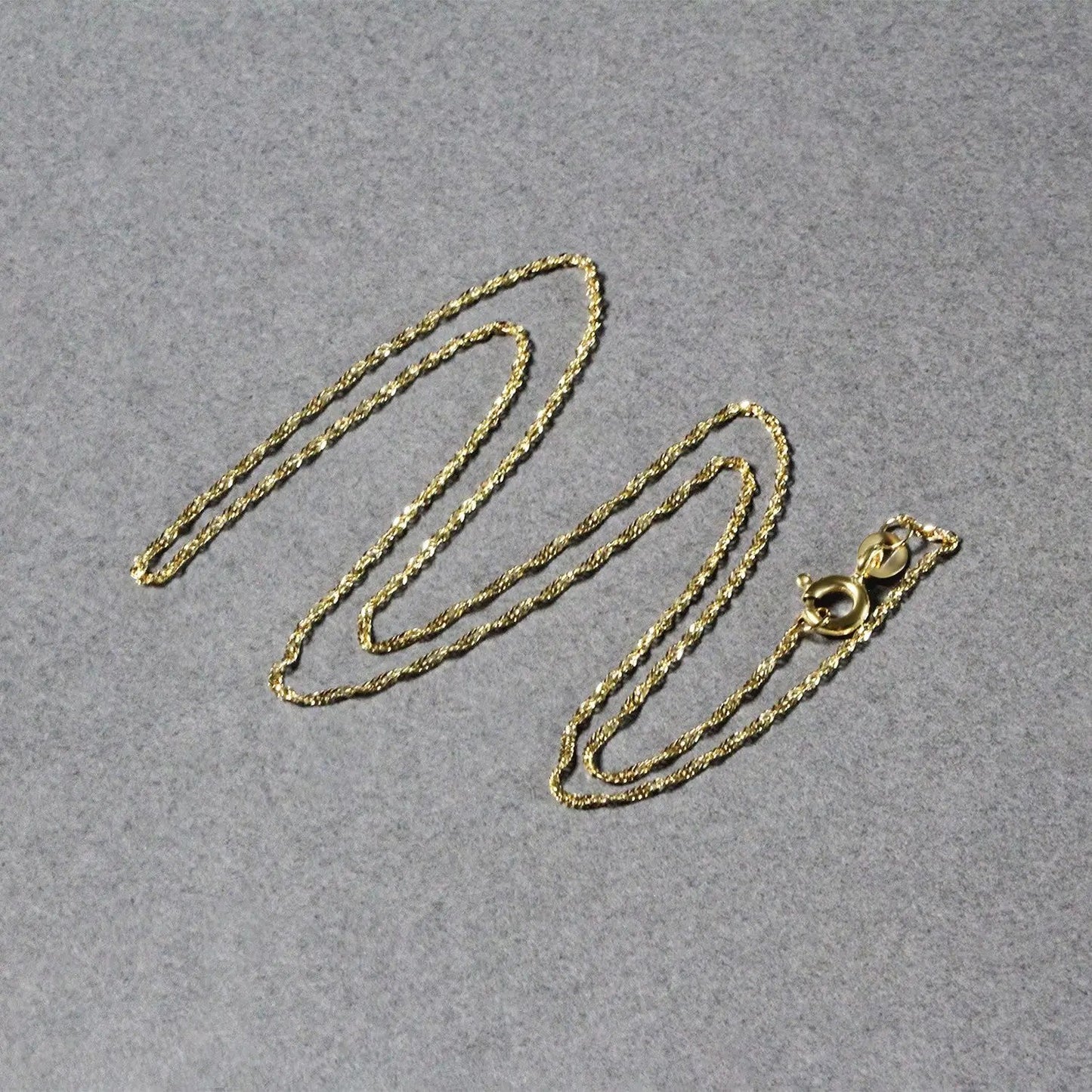 14k yellow gold Singapore chain necklace 1.0mm with rope texture and lobster clasp Bids.com on Tampa Home & Garden Store