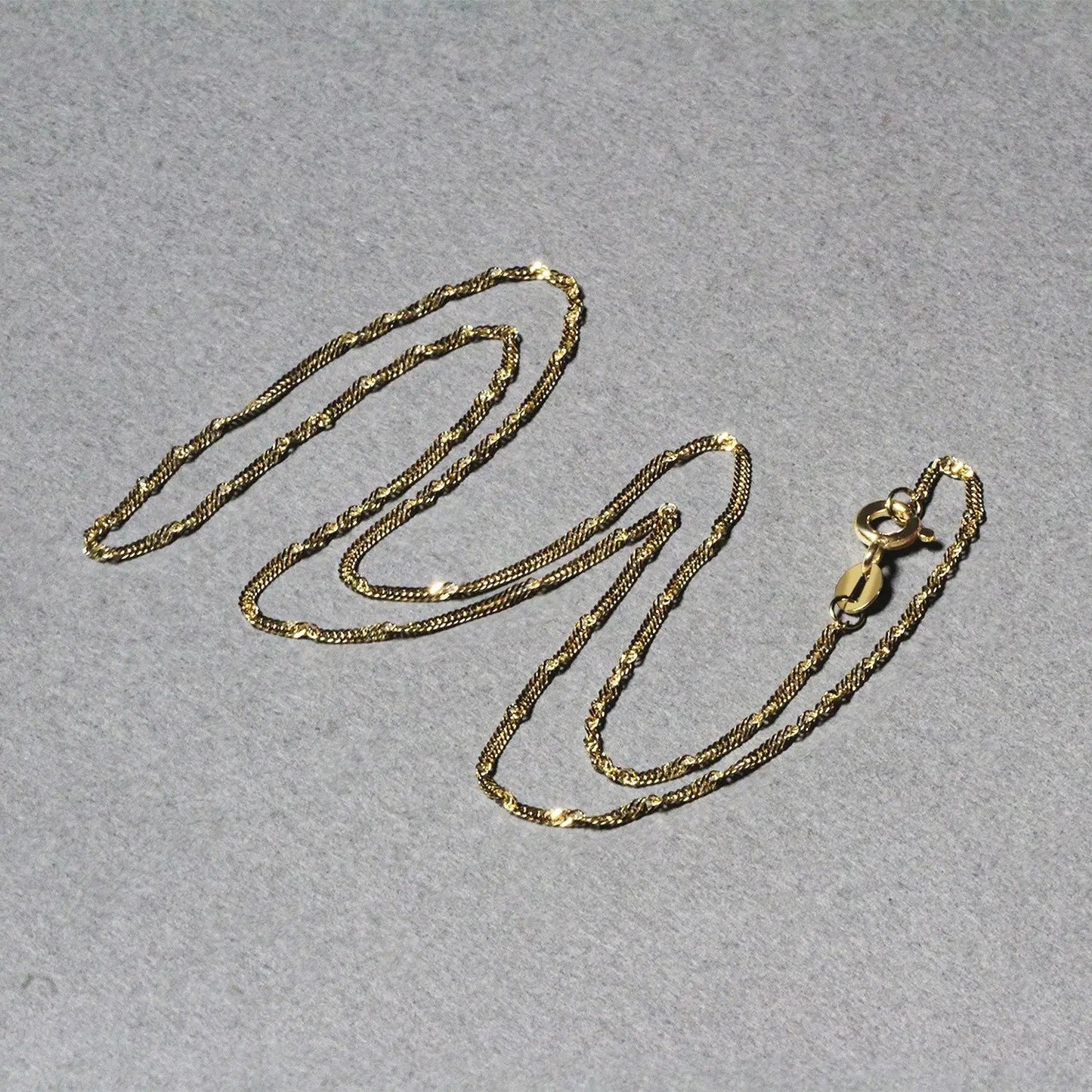 Set of three 14k yellow gold Singapore chain necklaces 1.5mm with lobster clasps on Tampa Home & Garden Store