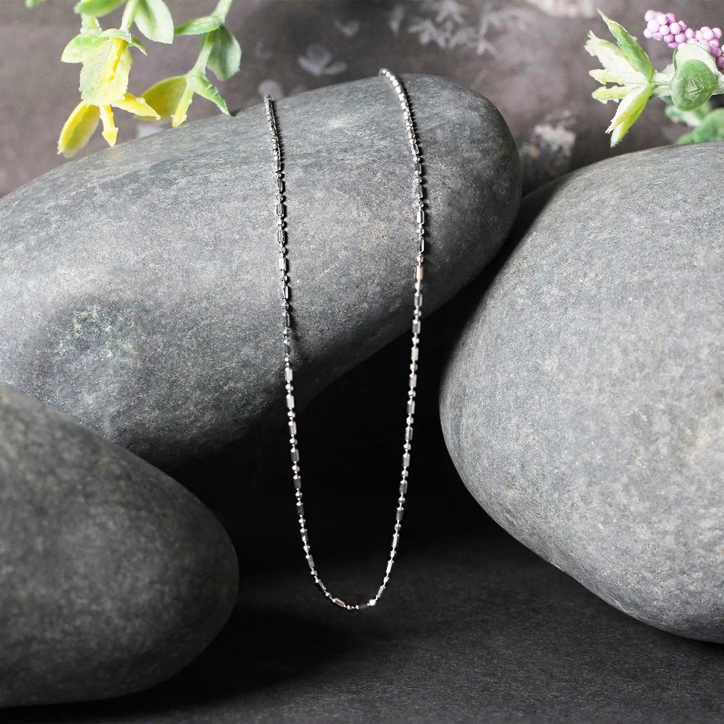 14k white gold diamond-cut bead chain necklace 1.0mm, two strands draped on stones on Tampa Home & Garden Store
