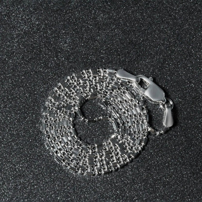 14k white gold diamond-cut bead chain necklace 1.0mm thickness in a coiled presentation on Tampa Home & Garden Store