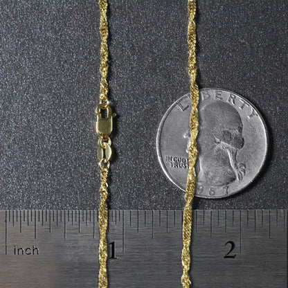 10k yellow gold Singapore chain necklace 1.80mm with lobster clasp by Bids.com beside a dime for scale on Tampa Home & Garden Store