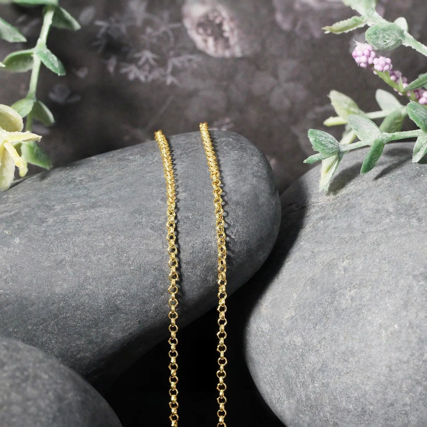 14k yellow gold rolo chain necklace 1.9mm, two delicate chains displayed on smooth gray stones on Tampa Home & Garden Store