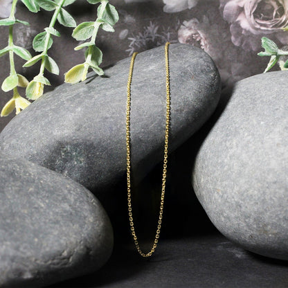 18k yellow gold diamond-cut cable link necklace, two 1.10 mm chains displayed on gray stones on Tampa Home & Garden Store