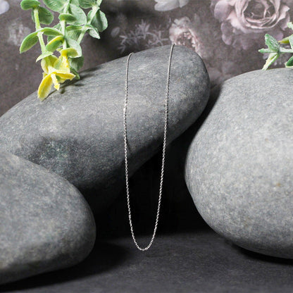 14k white gold diamond-cut cable link necklace 0.7mm by Bids.com, silver chain over gray stones on Tampa Home & Garden Store